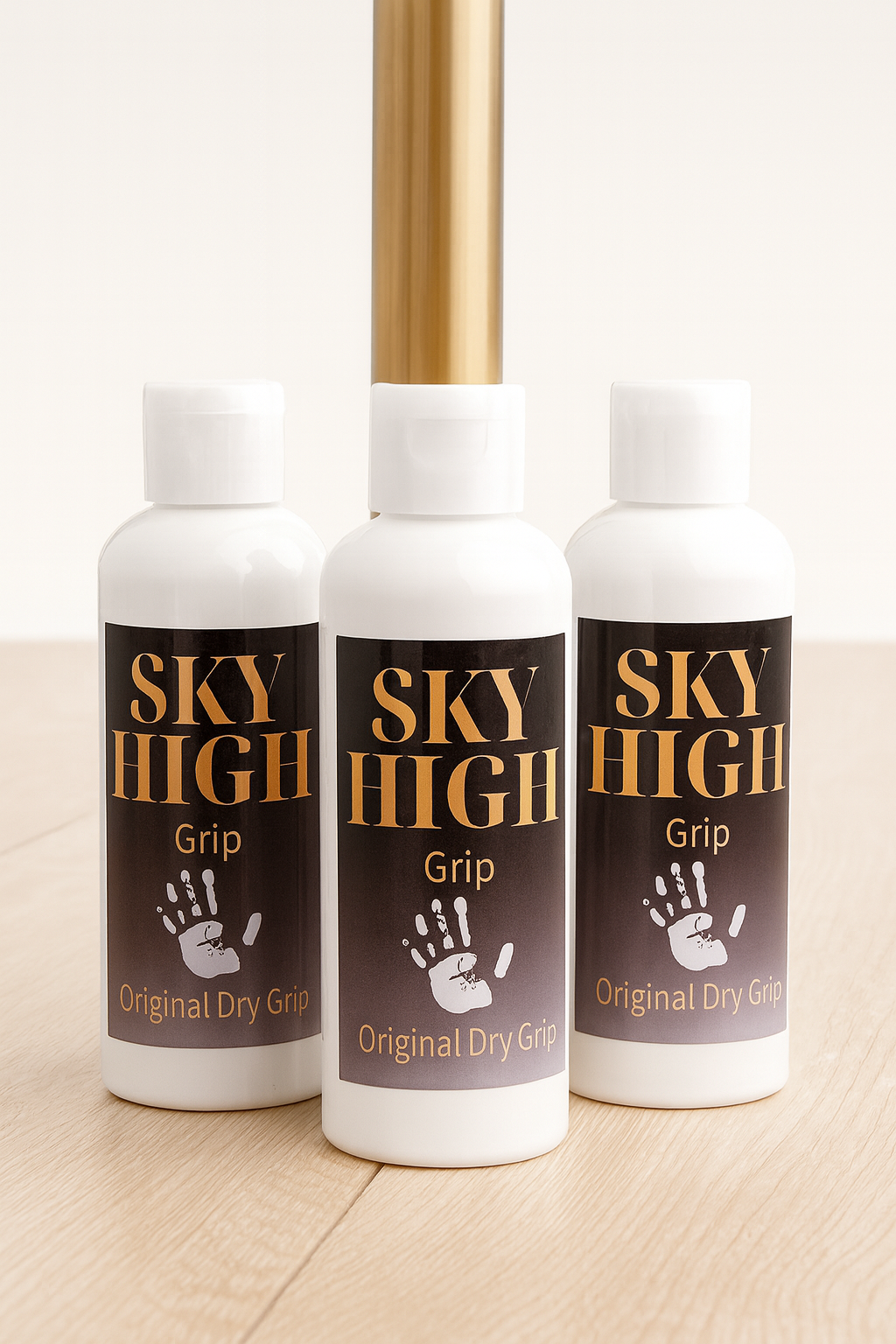 Three bottles of Sky High Grip Original Dry Grip on a wooden surface.