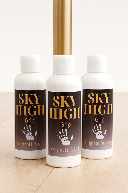 Three bottles of Sky High Grip Original Dry Grip on a wooden surface.